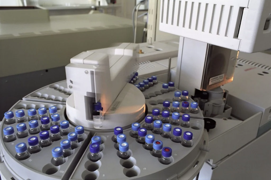 HPLC autosampler tray holding peptide vials during independent purity testing