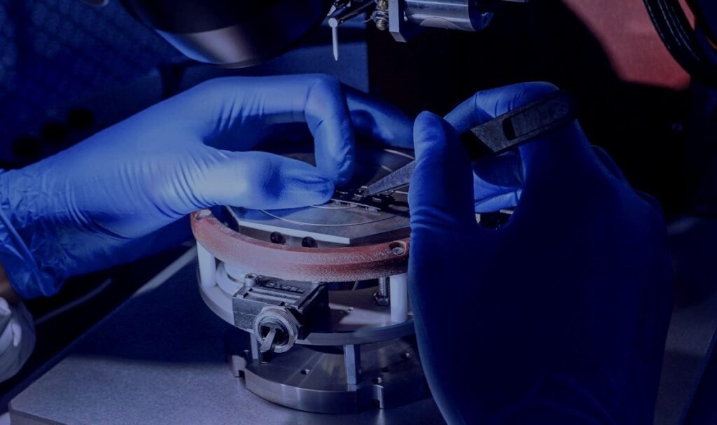 Gloved hands working with precision laboratory equipment – PerformanceLabs UK