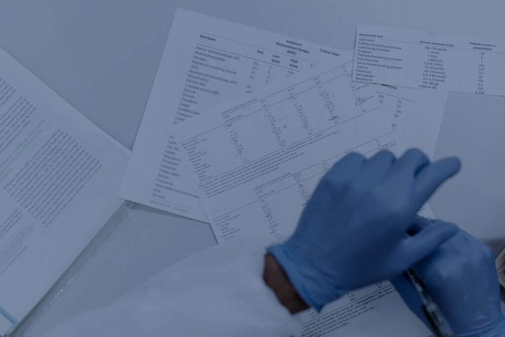Gloved hands reviewing an analytical Certificate of Analysis – PerformanceLabs UK